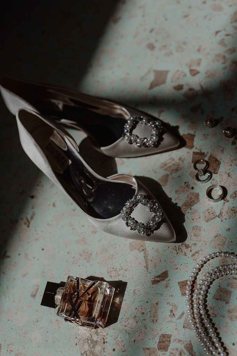 Bridal shoes and accessories on patterned fabric, elegant wedding details in Mexico, wedding photographer in Mexico.