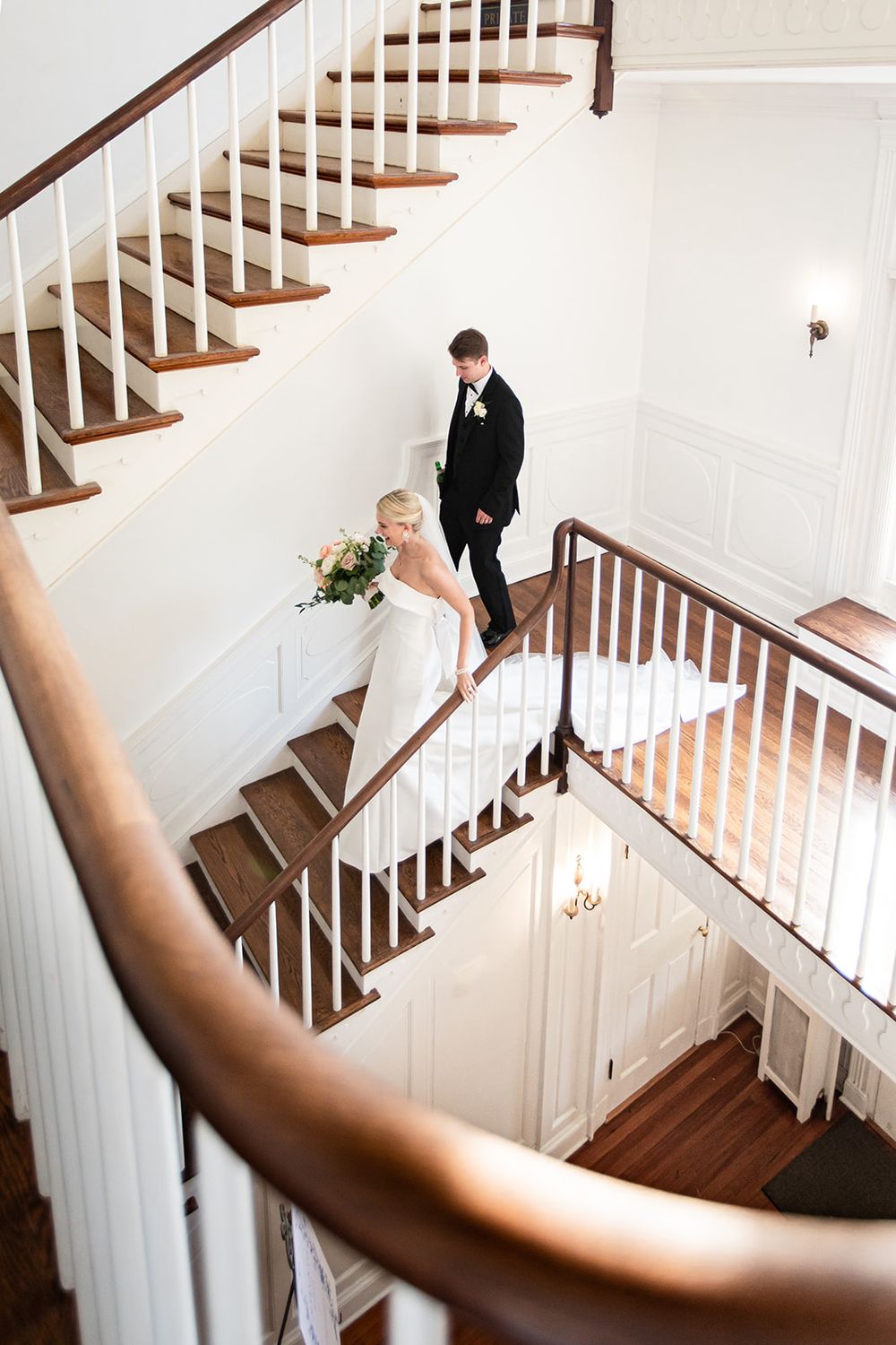 A series of elegant wedding photos captured on a white staircase with wooden railings and steps.