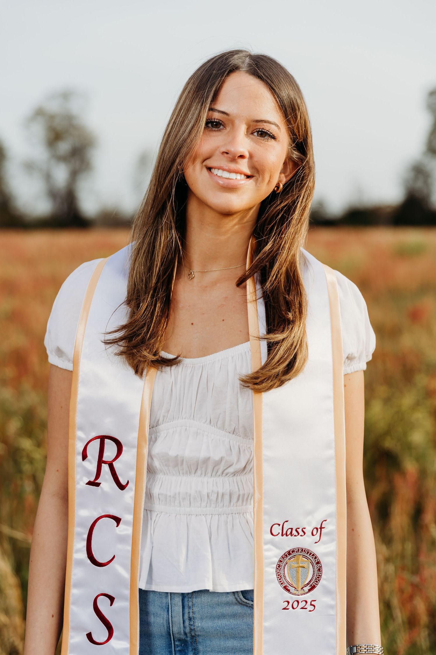 Set of graduation images showing a white graduation stole with embroidery against sunny outdoor backdrop.