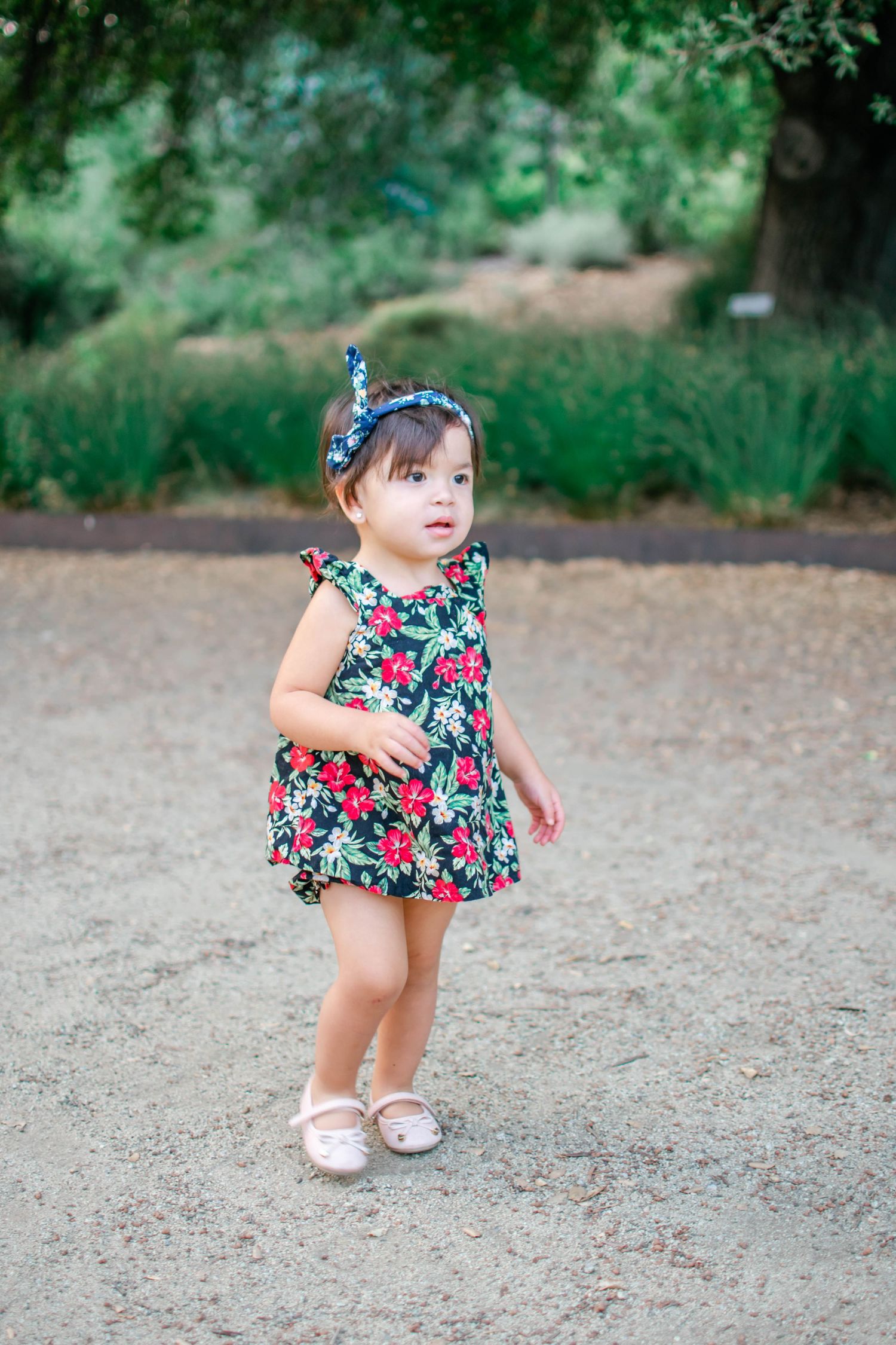 Sequence of photos featuring a floral dress against a natural outdoor setting with gravel and greenery.