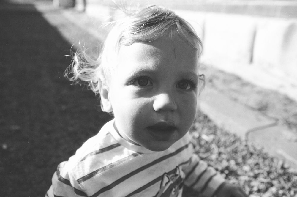 Authentic family photos of a Perth family with twins, captured during a playful backyard session.