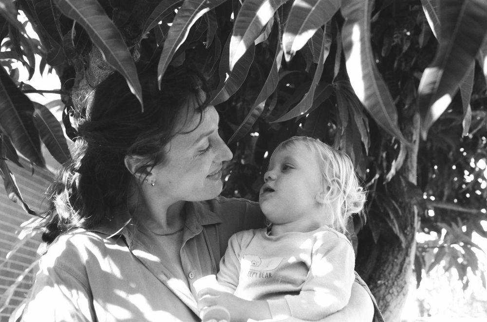 Joyful family photography session in Perth, with twins and parents playing outdoors