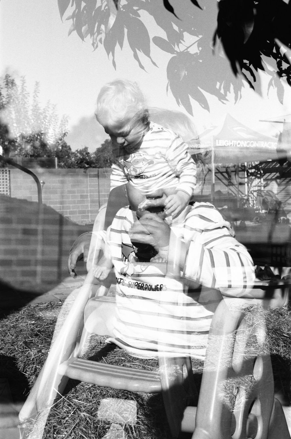 Joyful family photography session in Perth, with twins and parents playing outdoors