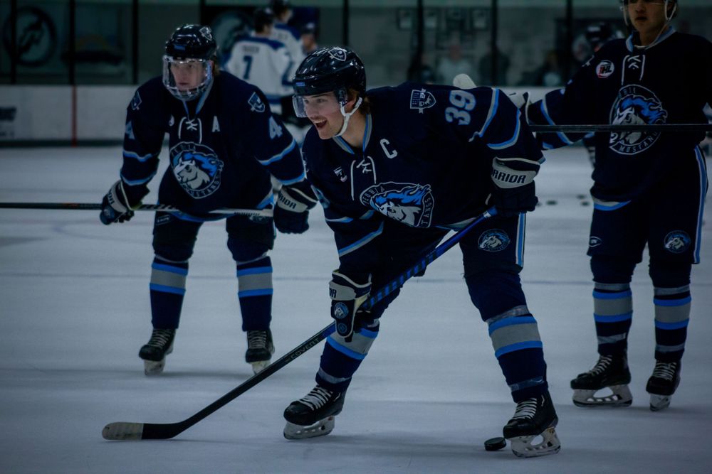 Captain Sam Truxaw positions for play during warmups.