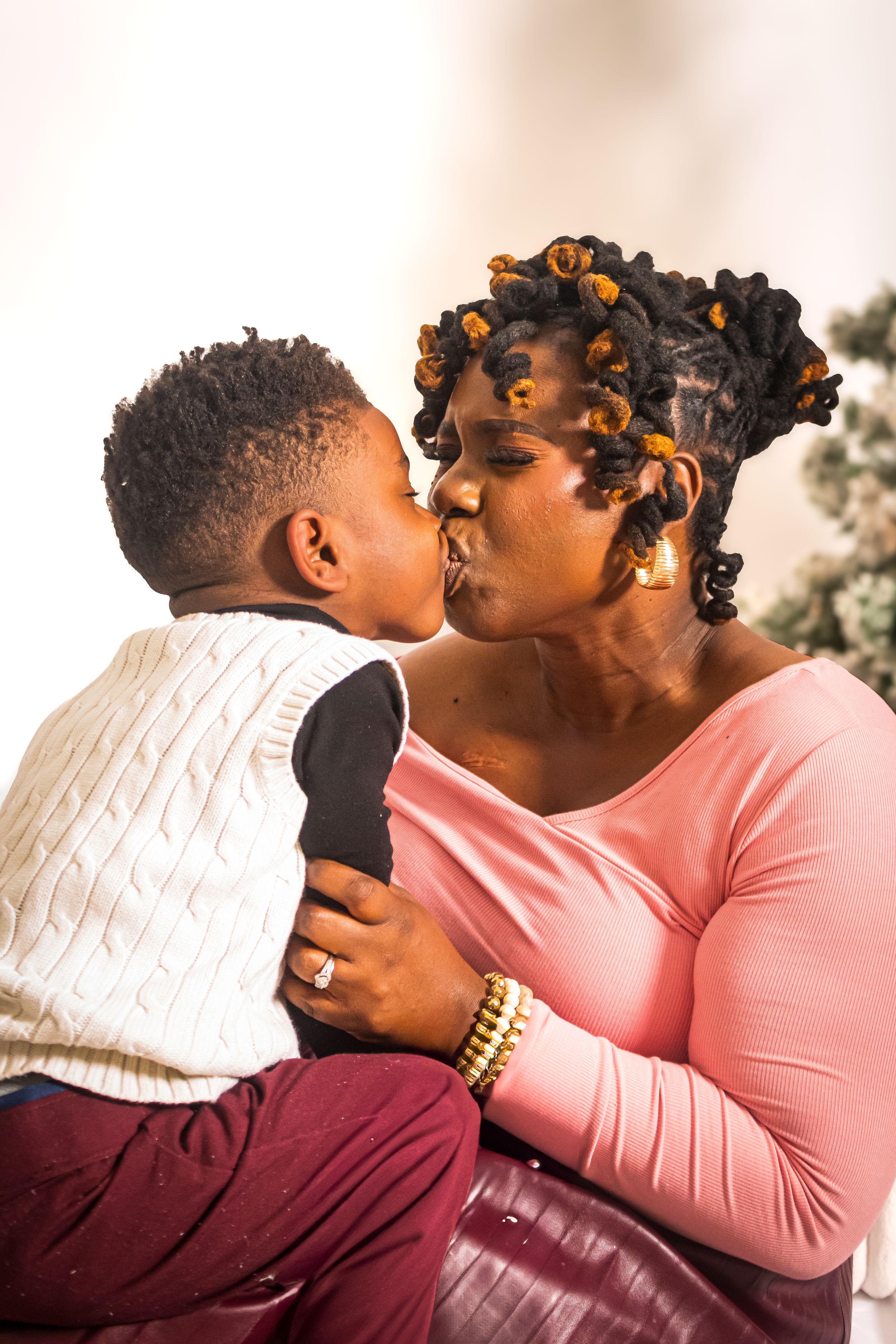 Intimate outdoor family portrait with warm golden lighting and natural expressions.