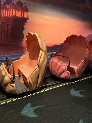 Four sequential motion frames show silhouetted roses casting shadows against a warm sunset-colored background with floor grid.