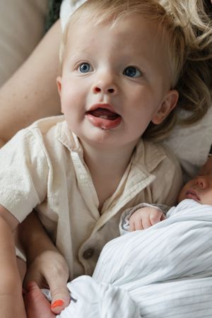 toddler brother with drool coming out of his mouth and bright blue eyes