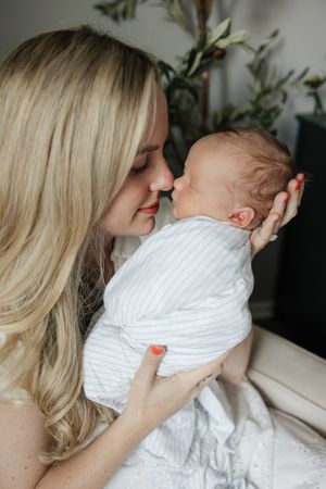 moms nose touching sleeping newborn baby boys nose newborn photography kansas city