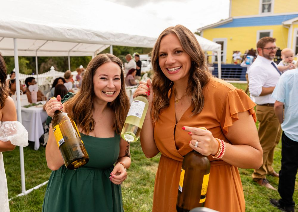 Wedding Reception girls with wine at backyard garden wedding in Omaha, Nebraska. - BrightSide Photography