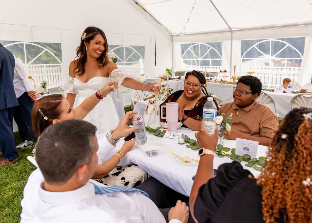 Bride at Wedding Reception at backyard garden wedding in Omaha, Nebraska. - BrightSide Photography