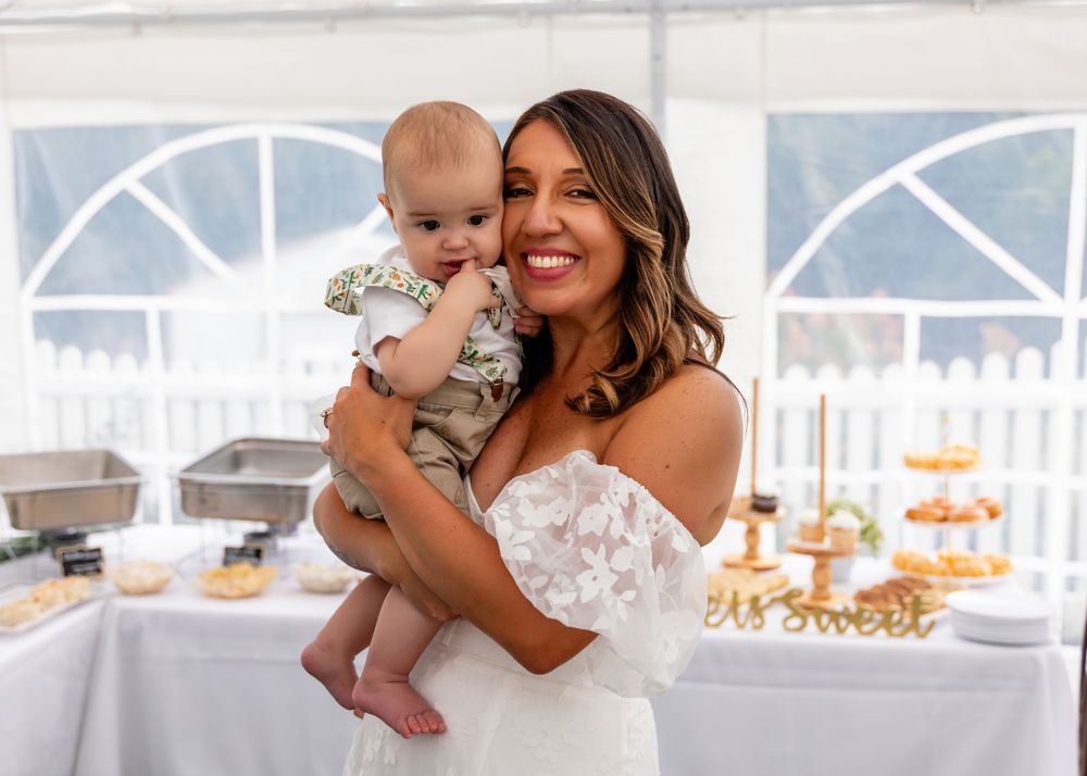 Bride with guests at Wedding Reception at backyard garden wedding in Omaha, Nebraska. - BrightSide Photography
