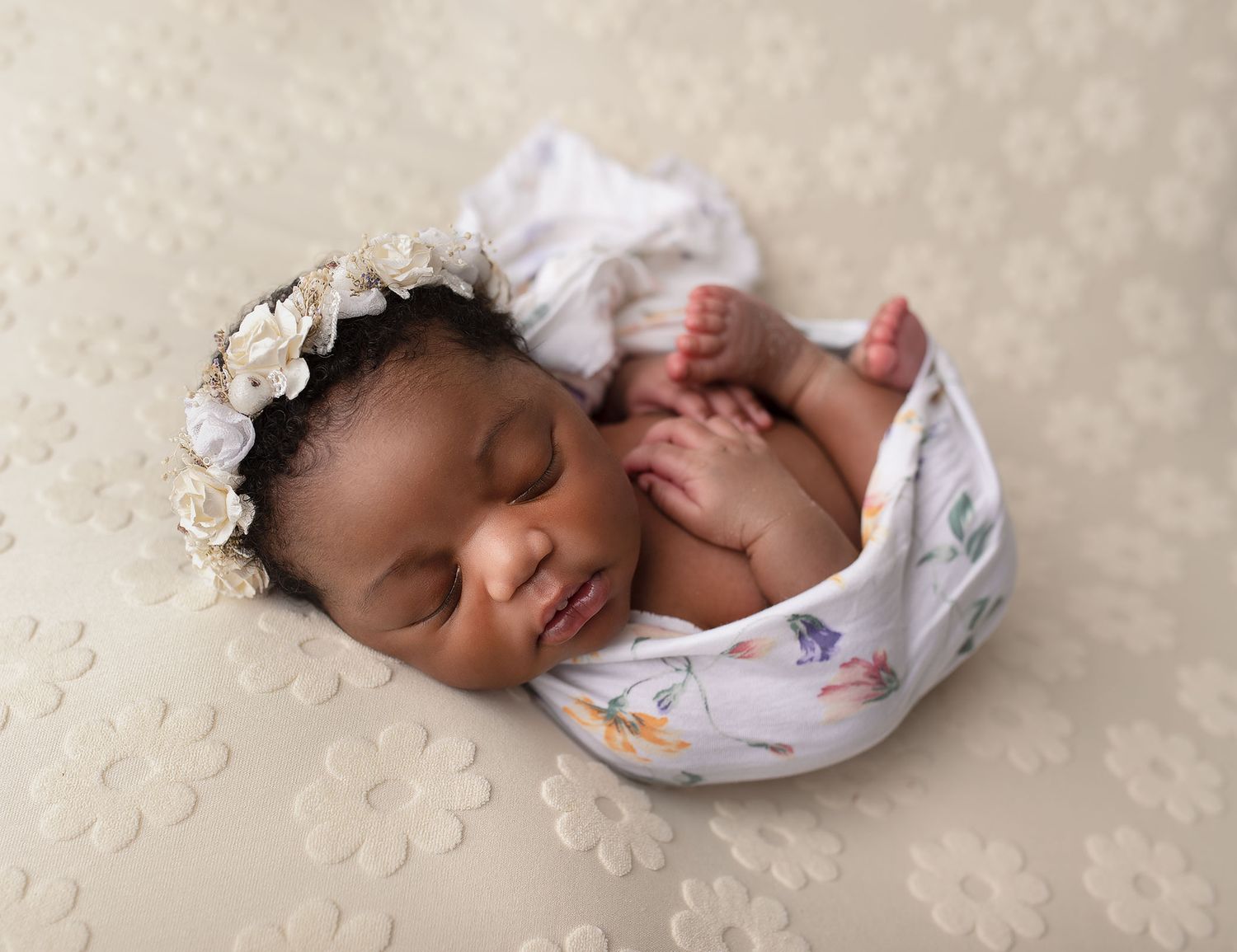 Newborn baby snuggled with a soft teddy bear, capturing sweet innocence, cozy details and timeless early moments in gentle neutral tones.