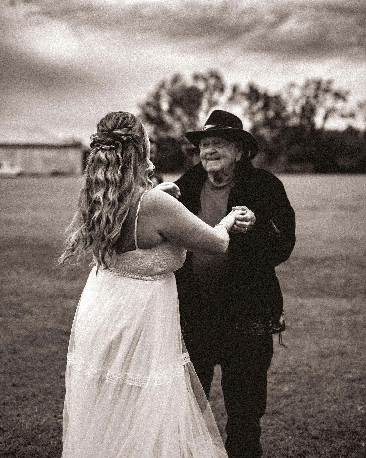 Live Oak, Florida wedding in the fall. Granddaughter and grandfather having a special dance during this fun and romantic wedding session.