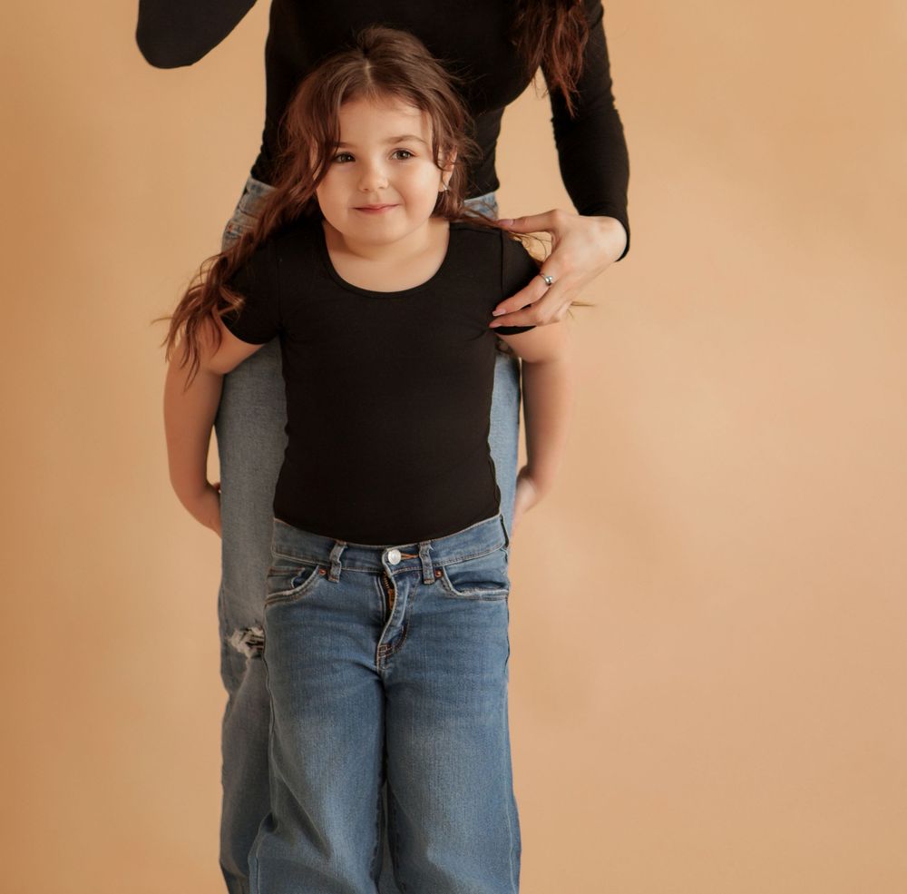 Casual lifestyle portraits showing people in matching outfits against a beige wall.