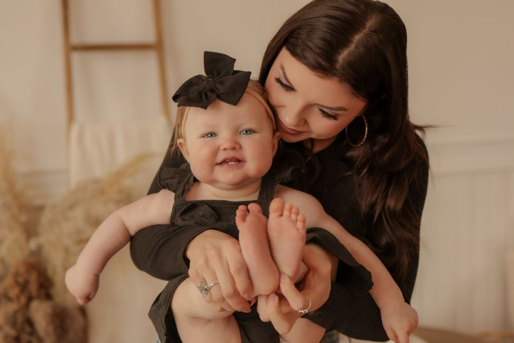 Intimate family portrait session with warm lighting and natural elements.