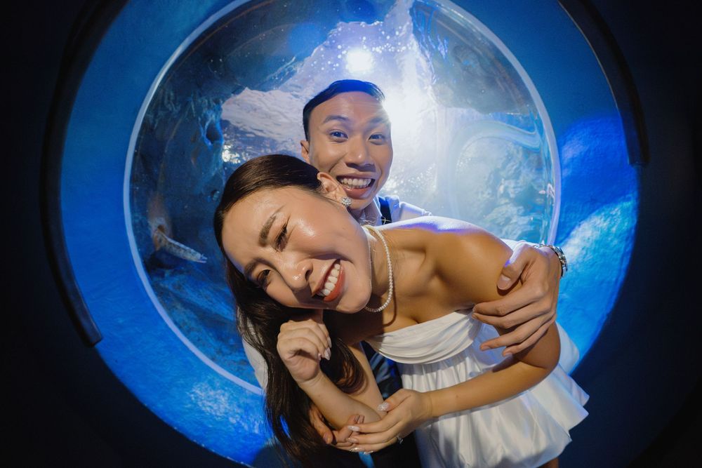A sequence of photos taken through a blue circular lens shows playful expressions and poses against a dark background.