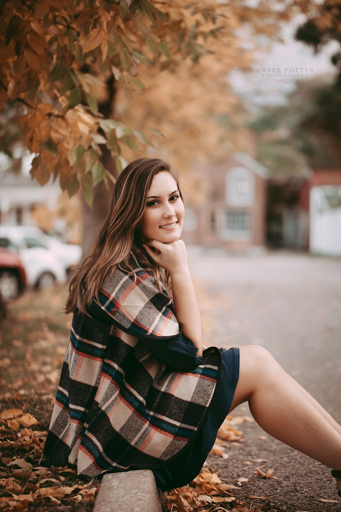 Fall senior portrait among colorful leaves – Springfield Missouri senior photographer.