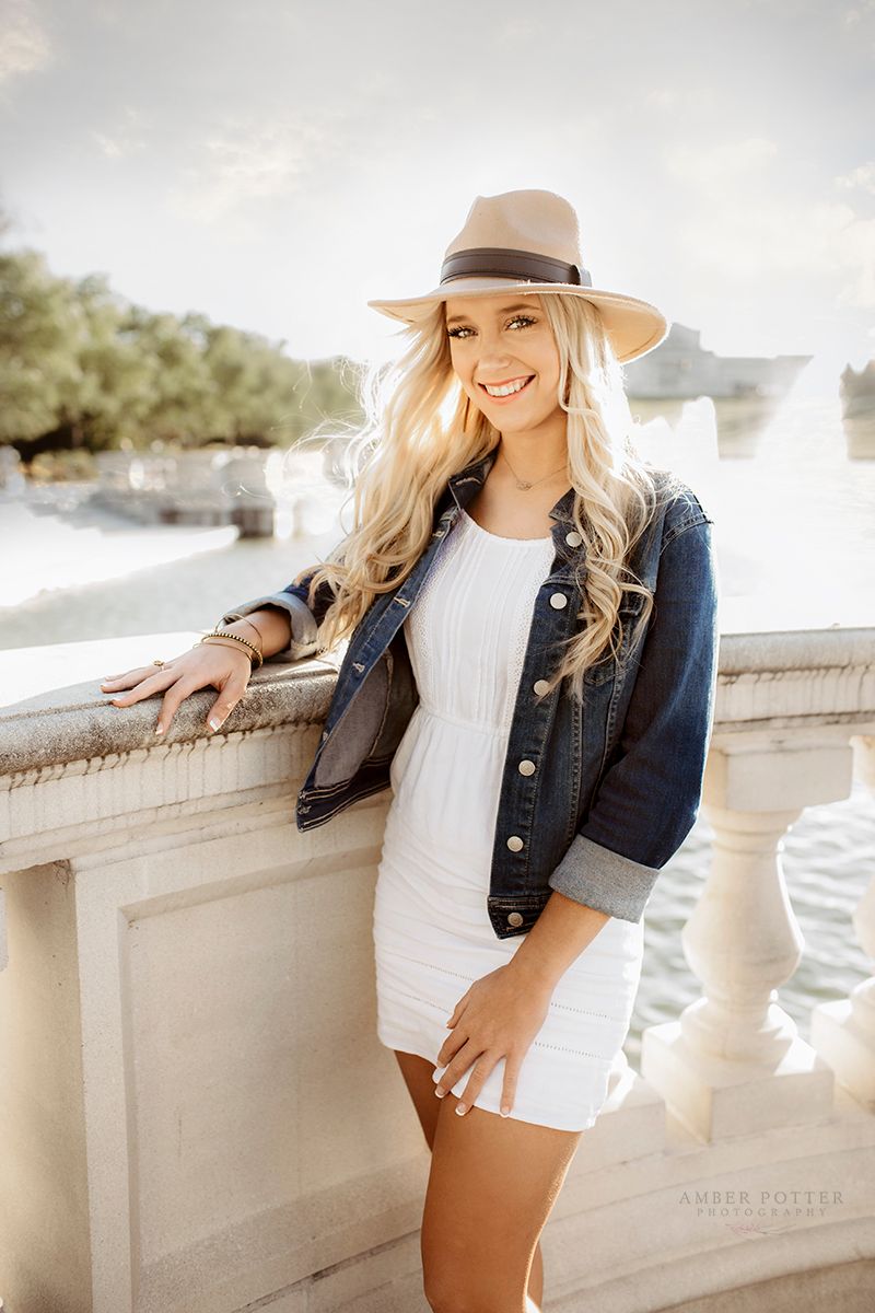 Senior girl smiling outdoors in summer light – Springfield MO senior portraits.