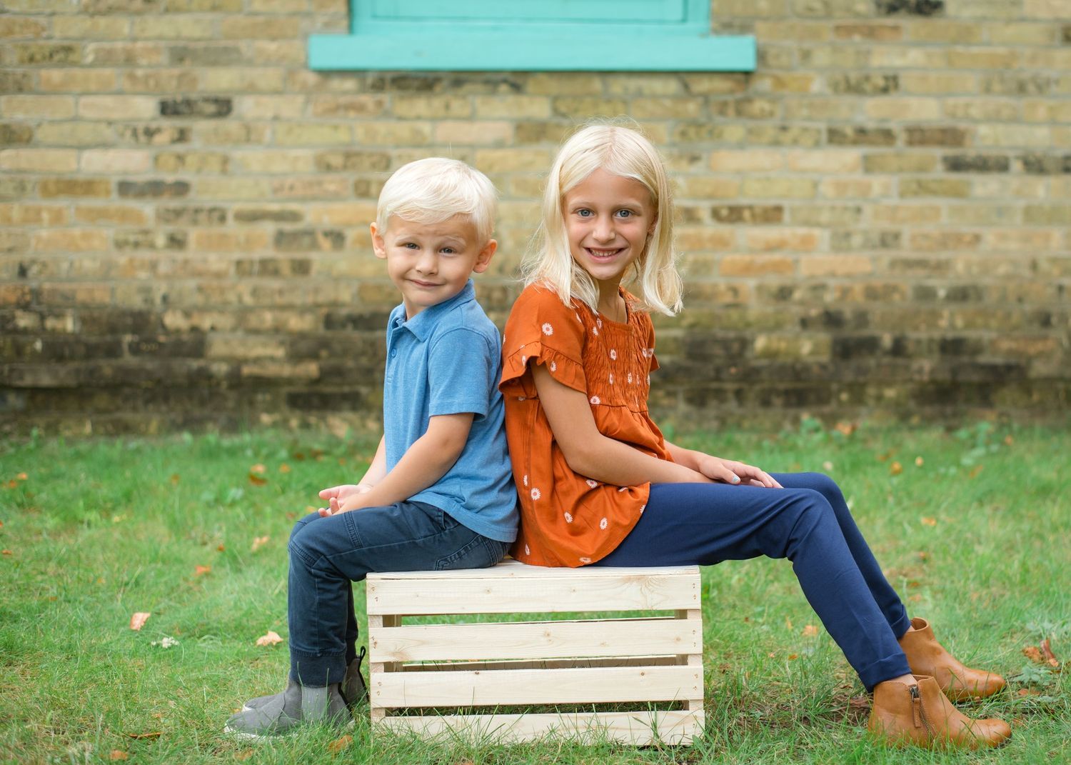 Collage of outdoor family portraits against a rustic brick wall and garden setting.