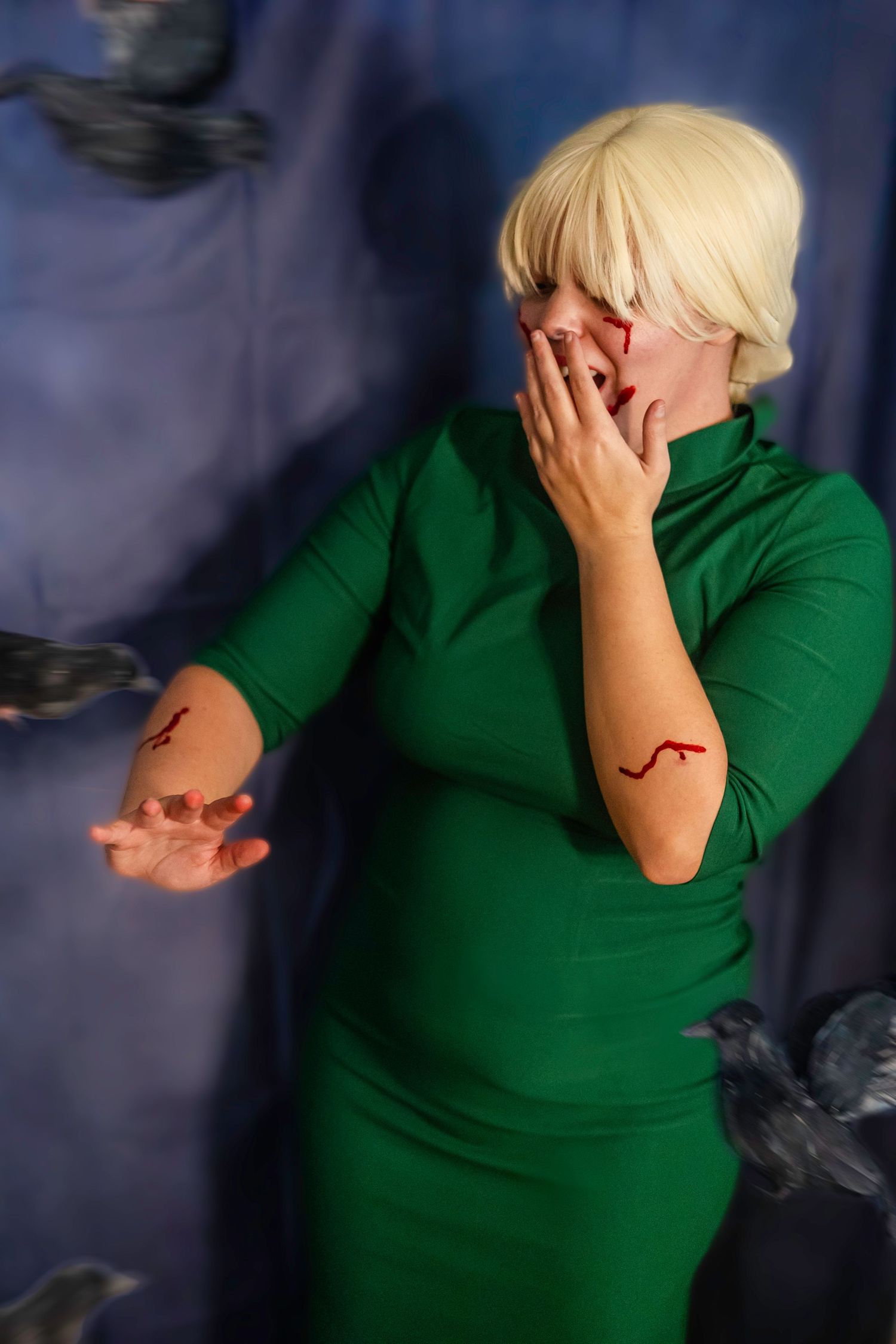 Person in emerald green pencil bodycon dress emotional distress the birds alfred hitchcock halloween costume