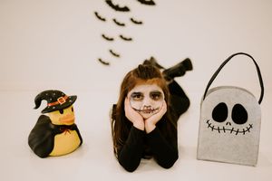 Decorative Halloween elements with black bats and character cutouts displayed in a line.