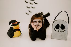 Spooky Halloween decor featuring bats and character silhouettes arranged horizontally.