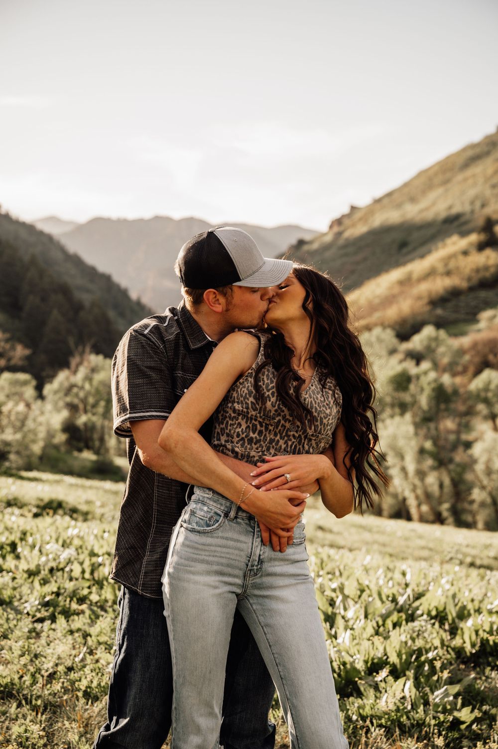 Intimate moments captured in a mountain meadow during golden hour.