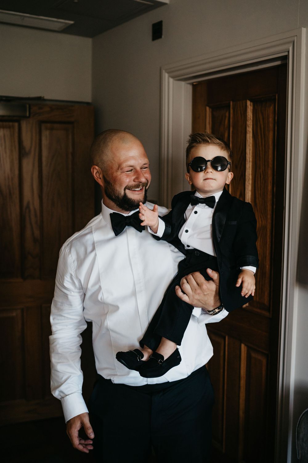A heartwarming sequence of candid moments between two people in formal black and white attire.