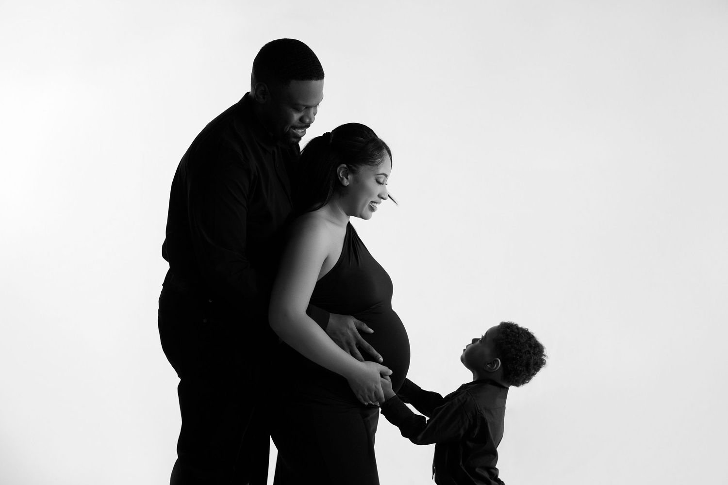 Silhouette series showing tender moments between parent and child.