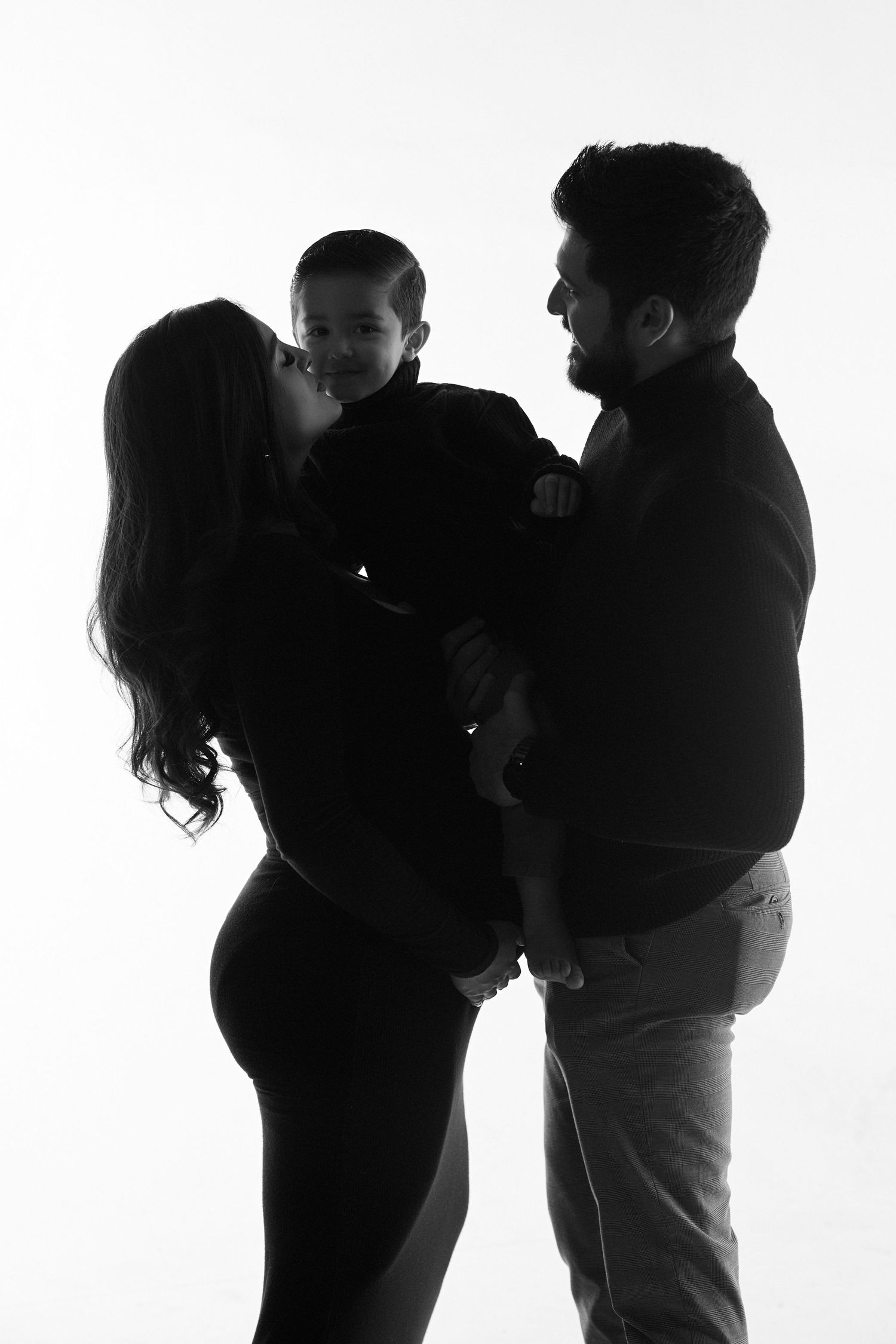 Artistic black and white silhouettes showing intimate couples posing together against white background.