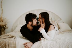 Romantic couple's photoshoot with minimalist styling and natural lighting.