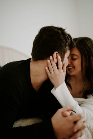 Intimate couple's photography session with dramatic lighting and close-up shots.