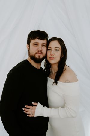 Intimate couple's portrait session featuring soft lighting and emotional connection.