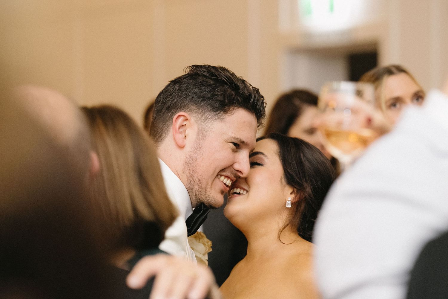 A tender moment shared between a couple during their wedding celebration.