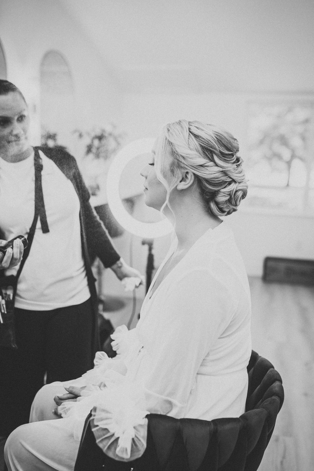 Black and white portrait during wedding preparation.