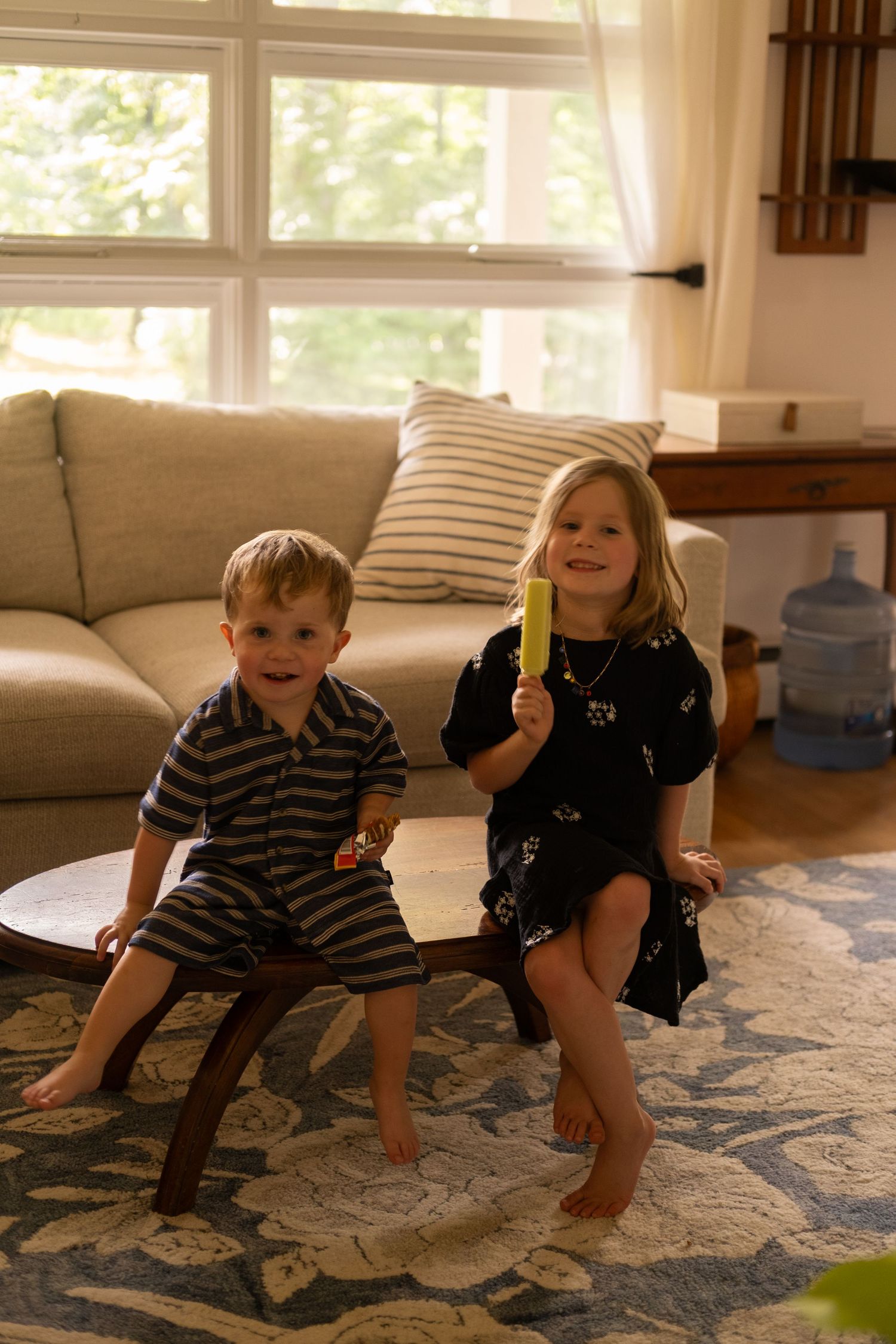 Candid film photography of children playing during a family portrait session.