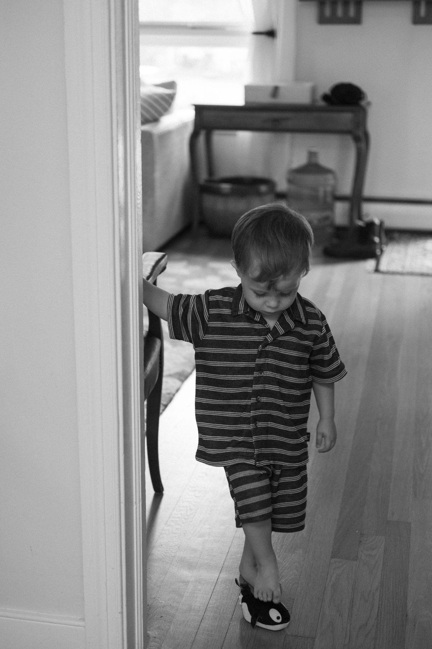 Candid film photography of children playing during a family portrait session.