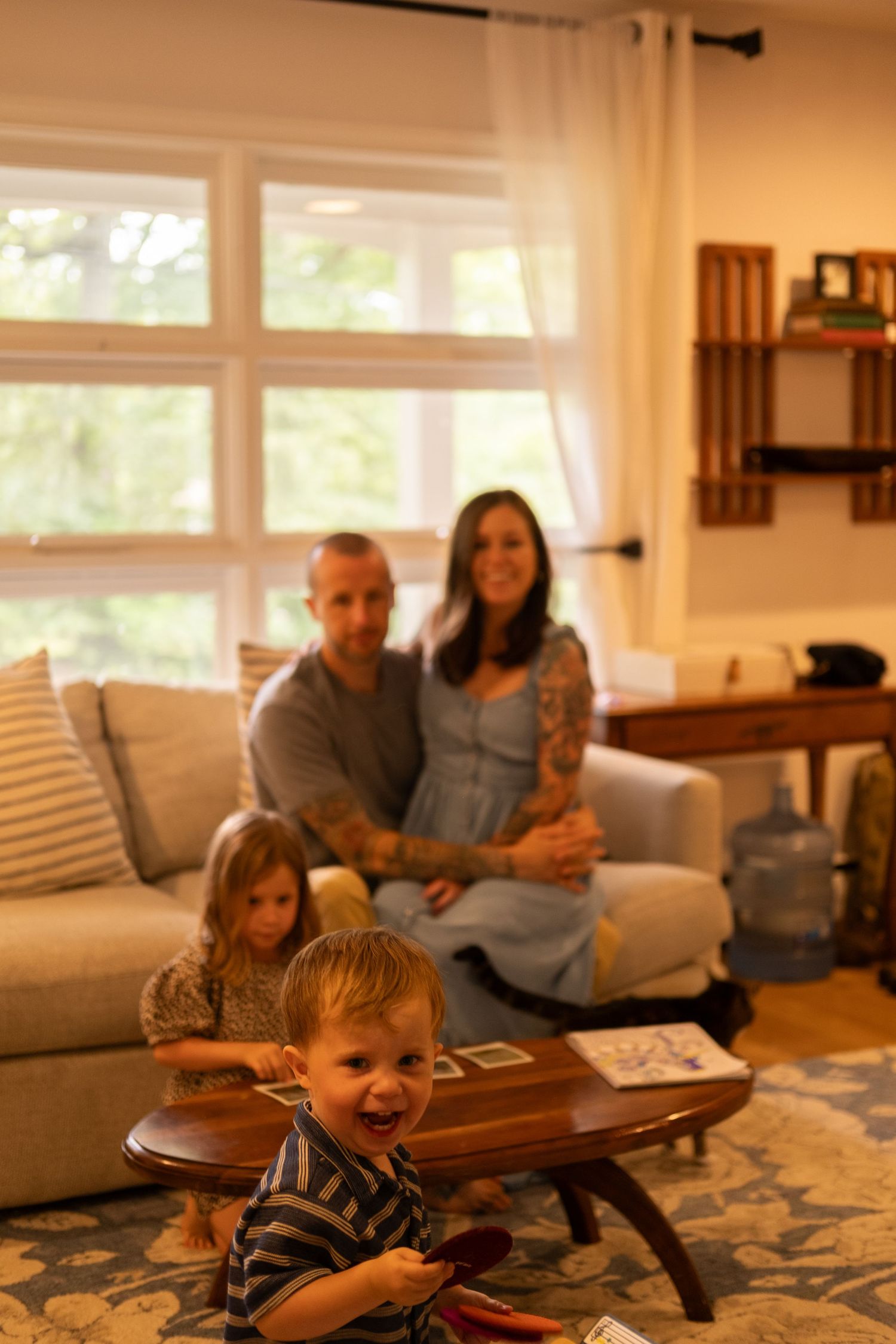 Candid film photography of children playing during a family portrait session.