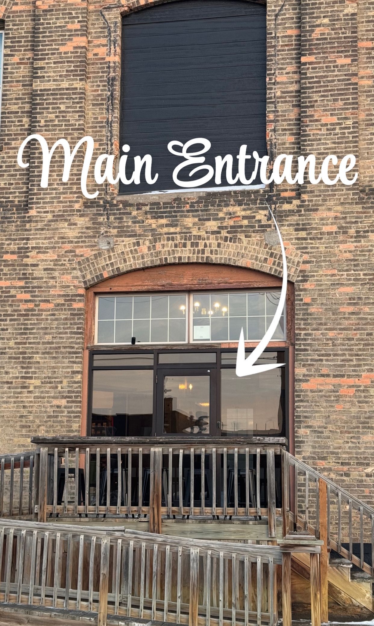 The Main Entrance to the building is unmarked. It is the door furthest to the right when sitting in the parking lot.