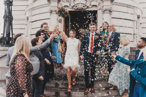 Wedding celebration with confetti shower on grand building steps at Lambeth Town Hall.