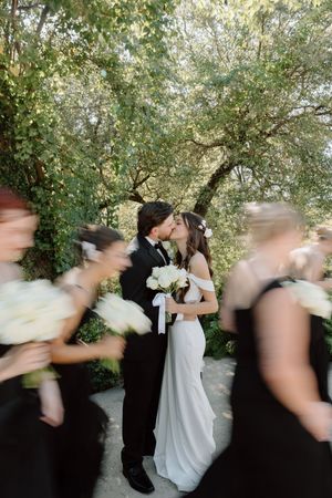 A sequence of motion-blurred wedding photos showing a couple dancing and spinning in an outdoor garden setting.