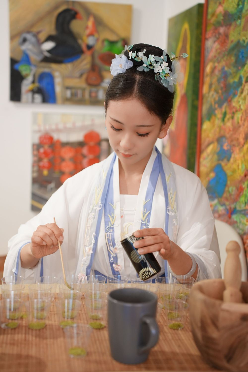 Event photography of diverse guests enjoying a traditional Chinese tea culture experience in Hanfu, by an Auckland photographer.