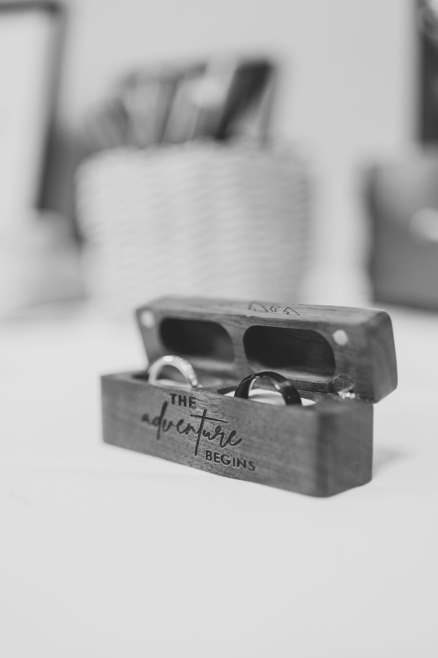 A series of wooden boxes or holders with engraved text shown in a blurred gradient perspective.
