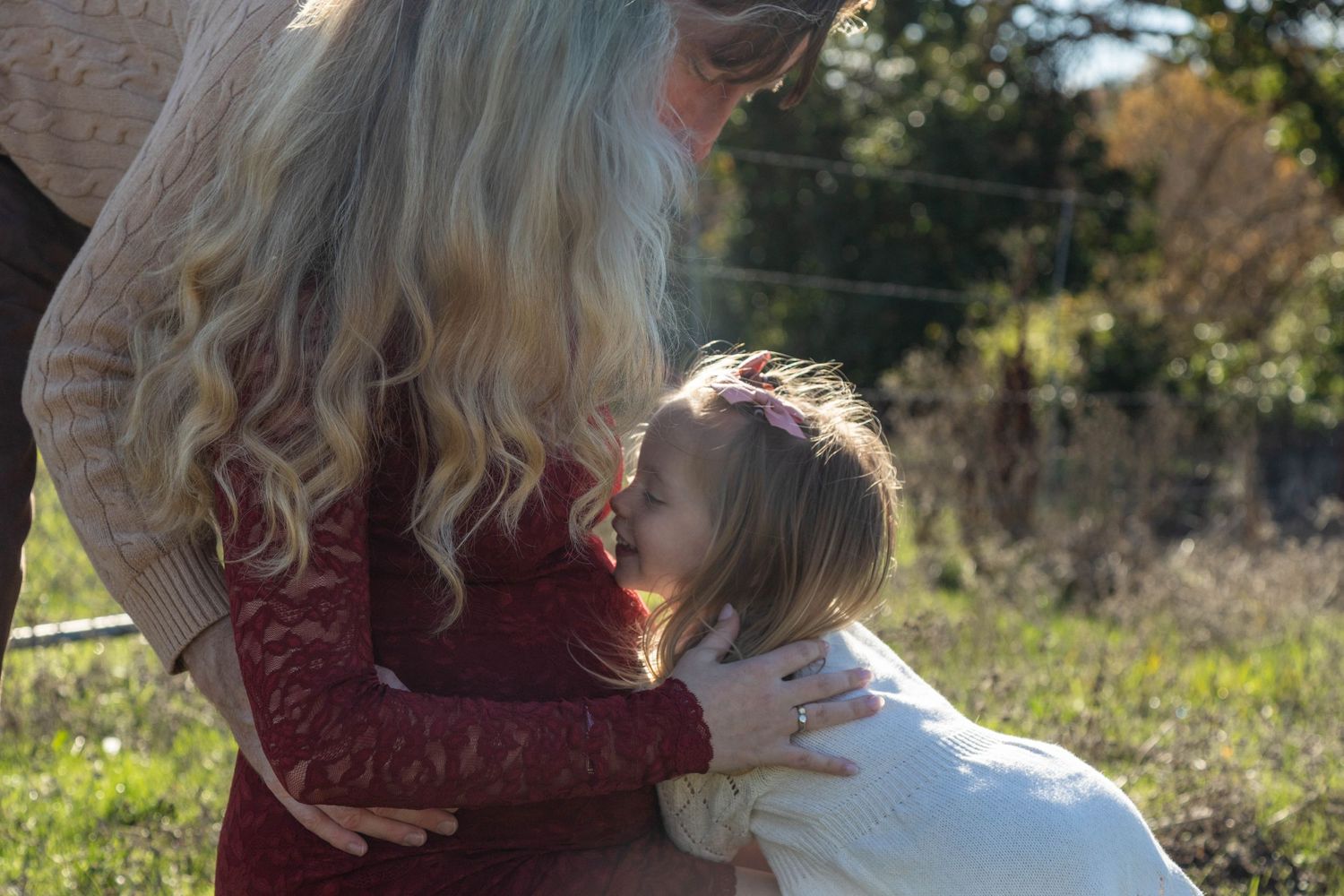 Shannon Lily Crosby Photography, maternity photo of a mom, dad, and daughter