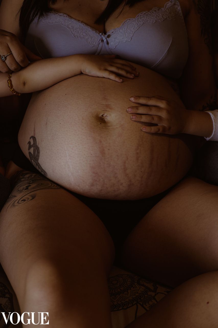 vogue, colour, portrait of pregnant belly, toddlers daughters hands loving on bump, Norfolk, natural light, emotive, warm, moody, maternity