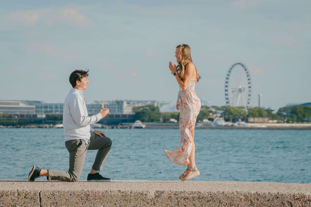 Romantic proposal sequence along Chicago's lakefront with Navy Pier visible in the background.