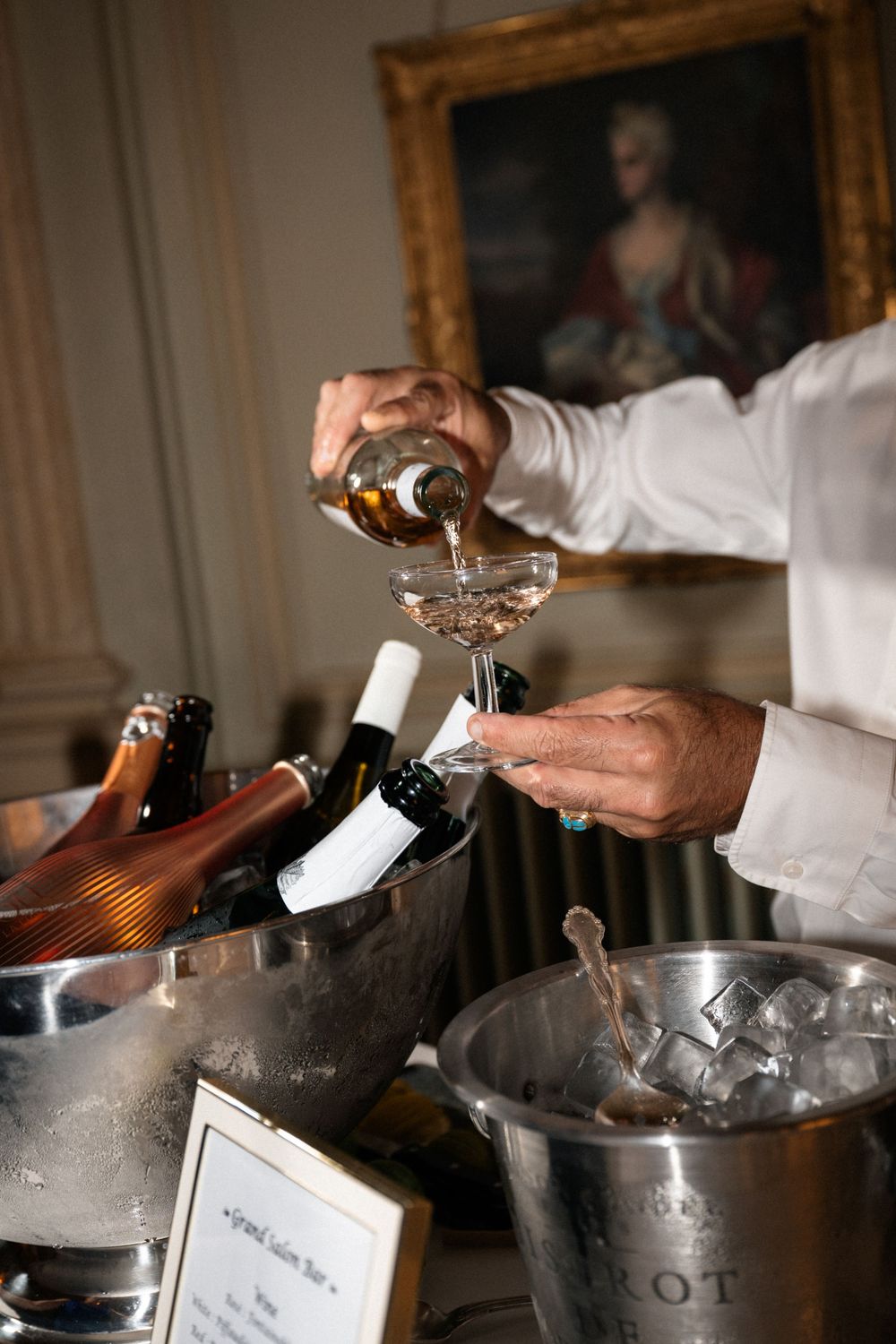 Close-up shots of bartender pouring and mixing drinks with professional bar equipment and ice.
