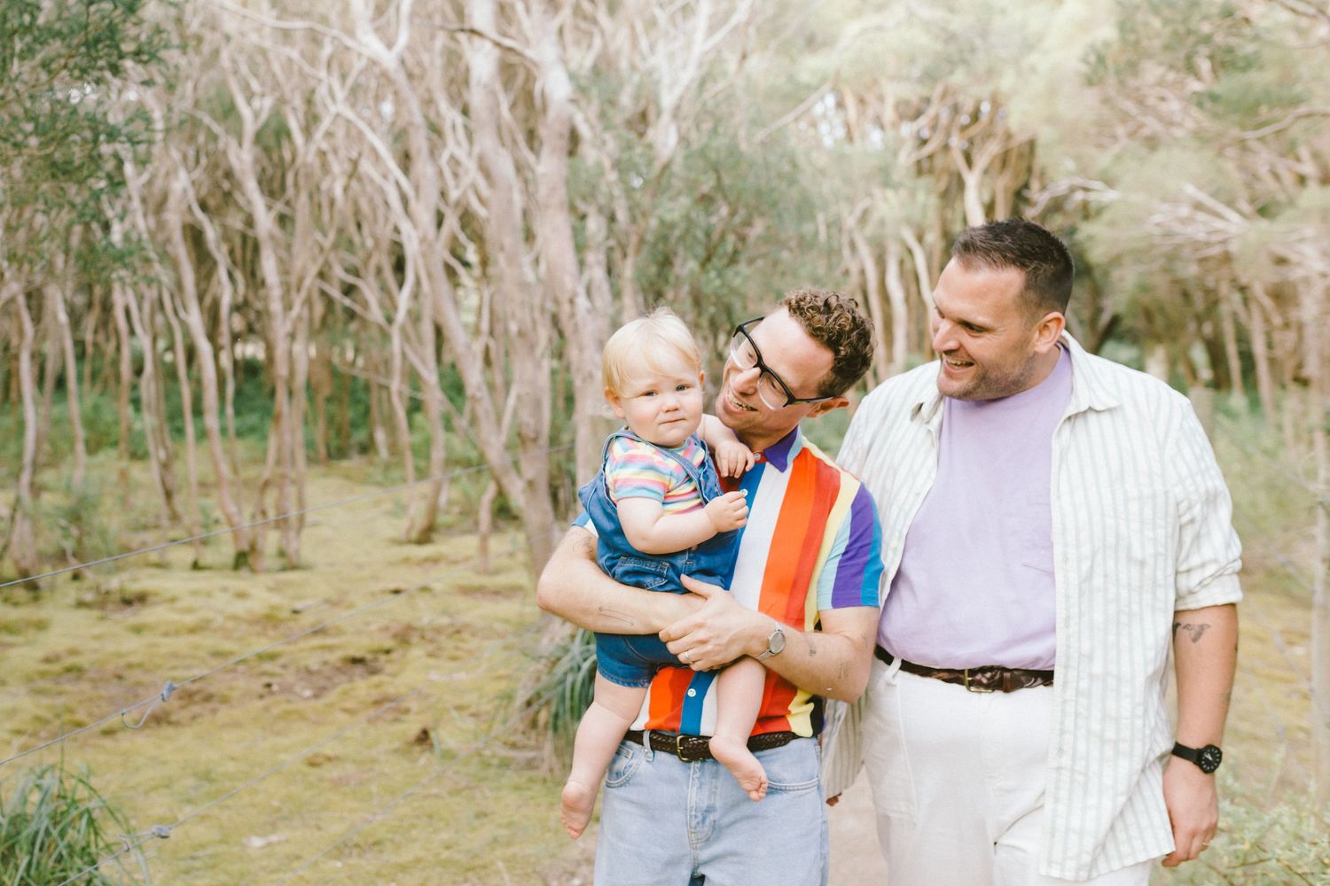 A series of candid outdoor family photos showing tender moments between parents and children in a natural setting.