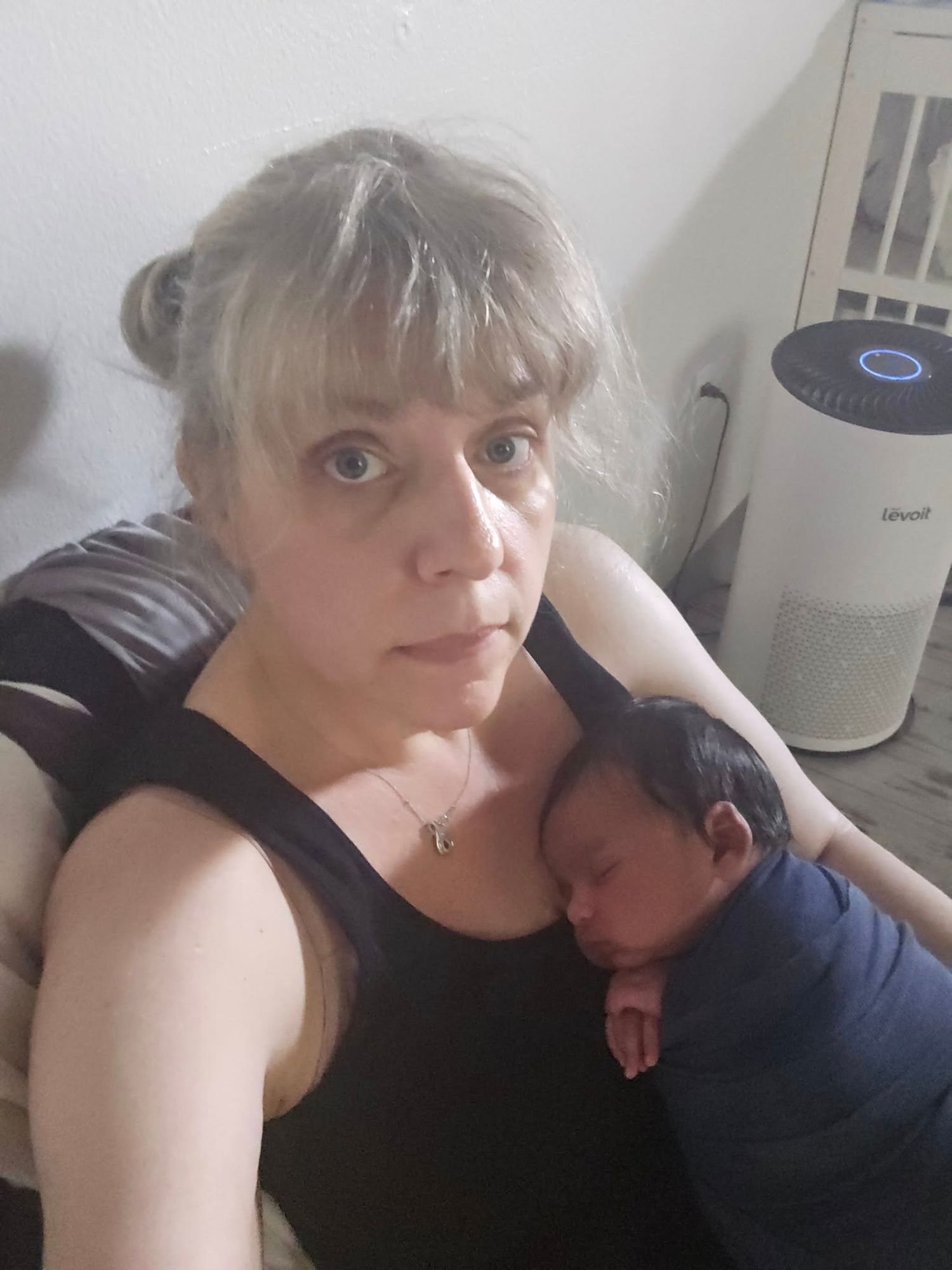 Valerie Steinkoenig selfie.  BTS during a newborn session soothing baby for next pose.
