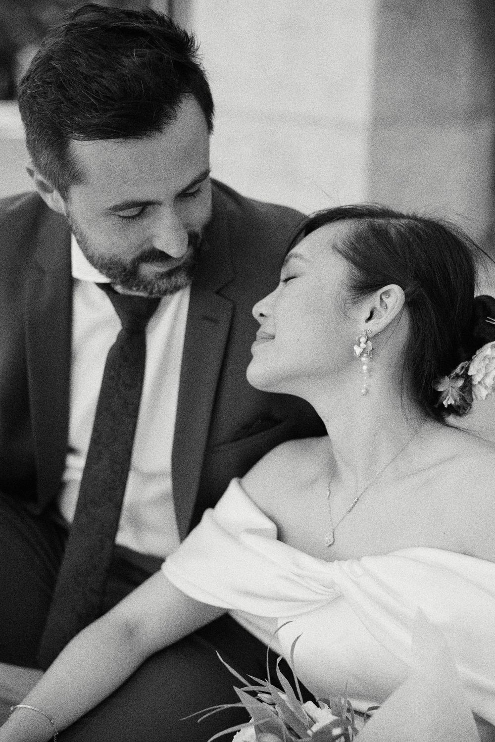 Black and white romantic wedding photo sequence showing tender intimate moments between newlyweds.